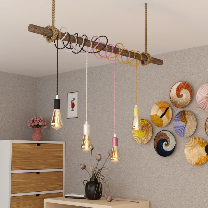 Colorful fabric-covered electrical cables in a visually appealing arrangement.